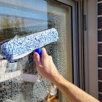 t-bar window washer cleaning glass